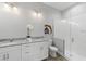 Stylish bathroom with a glass-enclosed shower, granite countertops, and dual sinks at 9303 N 19Th St, Tampa, FL 33612