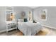 Bright bedroom features stylish decor, light gray walls, and natural light from the many windows at 9303 N 19Th St, Tampa, FL 33612