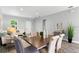Dining area featuring a table and chairs with an open concept to the living room at 9303 N 19Th St, Tampa, FL 33612