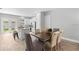 Dining area features a table and chairs, with views of the kitchen and backyard at 9303 N 19Th St, Tampa, FL 33612