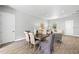 Dining area with wood floors, table and chairs, open to the living room at 9303 N 19Th St, Tampa, FL 33612