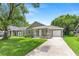 Charming single-story home with a well-maintained lawn and inviting front porch at 9303 N 19Th St, Tampa, FL 33612