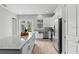 Bright kitchen with stainless steel appliances, granite countertops, and center island overlooking a view at 9303 N 19Th St, Tampa, FL 33612
