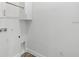 Functional laundry area with wall-mounted cabinets at 9303 N 19Th St, Tampa, FL 33612