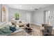 Comfortable living room with neutral tones, wood floors, and ample natural light at 9303 N 19Th St, Tampa, FL 33612