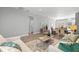 Open concept living room and dining area with modern furnishings and wood floors at 9303 N 19Th St, Tampa, FL 33612
