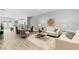 Spacious living room with modern decor, wood floors, and an open concept layout at 9303 N 19Th St, Tampa, FL 33612