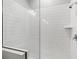 Modern shower featuring white subway tile and glass door at 9303 N 19Th St, Tampa, FL 33612