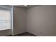 A bright bedroom has a window, neutral walls, standard outlets and neutral carpeting at 2105 Haydon Ct, Brandon, FL 33511