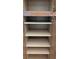 Empty wooden cabinets with adjustable shelves, perfect for organized kitchen storage at 2105 Haydon Ct, Brandon, FL 33511