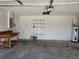 A spacious garage with a workbench, shelves providing ample space for projects and storage at 2105 Haydon Ct, Brandon, FL 33511