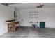 A spacious garage with a workbench, shelves providing ample space for projects and storage at 2105 Haydon Ct, Brandon, FL 33511
