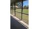Screened-in lanai providing clear views of the backyard and surrounding landscape at 2105 Haydon Ct, Brandon, FL 33511