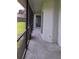 View of the enclosed lanai featuring access to a doorway and natural light at 2105 Haydon Ct, Brandon, FL 33511