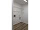 This laundry room features vinyl flooring and wire shelving at 2105 Haydon Ct, Brandon, FL 33511