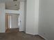 Open-concept living area with plush carpeting and bright, neutral walls at 2105 Haydon Ct, Brandon, FL 33511
