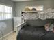 Cozy bedroom with a bunk bed, two dressers, and natural lighting from two windows at 10126 Bahama Ct, Seminole, FL 33776