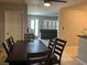 Inviting dining room features a ceiling fan and an open floor plan to the living room at 10126 Bahama Ct, Seminole, FL 33776