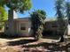 Home exterior showcasing a well-maintained backyard, patio, and lush landscaping, creating a private oasis at 10126 Bahama Ct, Seminole, FL 33776