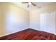 Bedroom features include hardwood floors, neutral walls, ceiling fan and a closet at 10641 Firebrick Ct, Trinity, FL 34655
