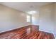 Bright, spacious bedroom with hardwood floors, natural light, and neutral walls at 10641 Firebrick Ct, Trinity, FL 34655