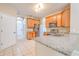 The kitchen features stainless steel appliances, granite countertops, and a tile floor at 10641 Firebrick Ct, Trinity, FL 34655