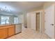 Open kitchen featuring granite countertops, stainless steel appliances and a pantry at 10641 Firebrick Ct, Trinity, FL 34655