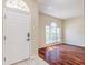 Inviting living room features a large window and gleaming hardwood floors at 10641 Firebrick Ct, Trinity, FL 34655