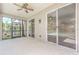 The screened patio offers a tranquil view of the backyard, blending indoor and outdoor living at 10641 Firebrick Ct, Trinity, FL 34655