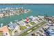 Panoramic aerial view showing the home's location on the water with access to the bay at 11125 7Th E St, Treasure Island, FL 33706