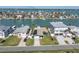 Aerial shot of a waterfront community with homes, docks, and beautiful bay views at 11125 7Th E St, Treasure Island, FL 33706