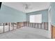 Bedroom featuring natural light and a ceiling fan; under construction after water damage at 11125 7Th E St, Treasure Island, FL 33706