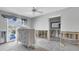 Bedroom showing water and outdoor pool from window with damaged drywall and partially exposed flooring and structure at 11125 7Th E St, Treasure Island, FL 33706