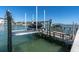 View of private boat dock with boat lift, ideal for boating enthusiasts and waterfront living at 11125 7Th E St, Treasure Island, FL 33706
