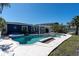 Lush backyard with a relaxing pool, spa, and pergola, creating a private oasis for unwinding and entertaining at 11125 7Th E St, Treasure Island, FL 33706
