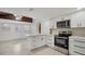 Bright kitchen with white cabinetry, stainless steel appliances, and center island at 11709 N Armenia Ave, Tampa, FL 33612