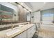 Bathroom boasts double vanities, granite counters, and tile backsplash at 13553 Landers Dr, Hudson, FL 34667