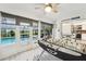 Bright game room with foosball table and pool views at 13553 Landers Dr, Hudson, FL 34667