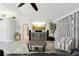 Comfortable living room featuring a large media center, neutral walls and a ceiling fan at 13553 Landers Dr, Hudson, FL 34667