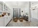 Well-lit sitting area with natural light, decorative accents, and light wood flooring at 13553 Landers Dr, Hudson, FL 34667