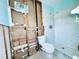 Bathroom featuring a tiled shower and newly installed toilet at 1800 New Hampshire Ne Ave, St Petersburg, FL 33703