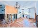 Partially renovated kitchen features white cabinets, tile floors, and some exposed framing ready for customization at 1800 New Hampshire Ne Ave, St Petersburg, FL 33703