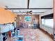 A partially renovated room showing tile floors, exposed wall framing, and a glimpse of the design at 1800 New Hampshire Ne Ave, St Petersburg, FL 33703
