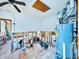 Spacious interior needing some work, featuring tile floors and exposed wall framing, with potential for customization at 1800 New Hampshire Ne Ave, St Petersburg, FL 33703