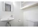 Clean half-bathroom with modern sink, toilet, and ample storage space at 1807 23Rd N Ave, St Petersburg, FL 33713