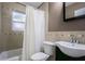 Cozy bathroom with shower/tub, patterned tiling, modern sink and fixtures at 1807 23Rd N Ave, St Petersburg, FL 33713