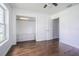 Bedroom with hardwood floors, closet with built in storage, and a view to the backyard at 1807 23Rd N Ave, St Petersburg, FL 33713