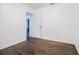 Bright bedroom featuring hardwood floors and a door that leads to other rooms in the house at 1807 23Rd N Ave, St Petersburg, FL 33713