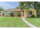 Charming single-story home with a well-manicured lawn and inviting front entrance at 1807 23Rd N Ave, St Petersburg, FL 33713