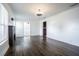 Spacious living room boasts hardwood floors, natural light, and a decorative fireplace at 1807 23Rd N Ave, St Petersburg, FL 33713
